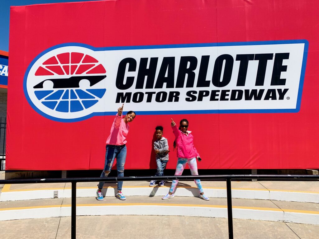 A family poses for a photo inside the speedway's Victory Lane.