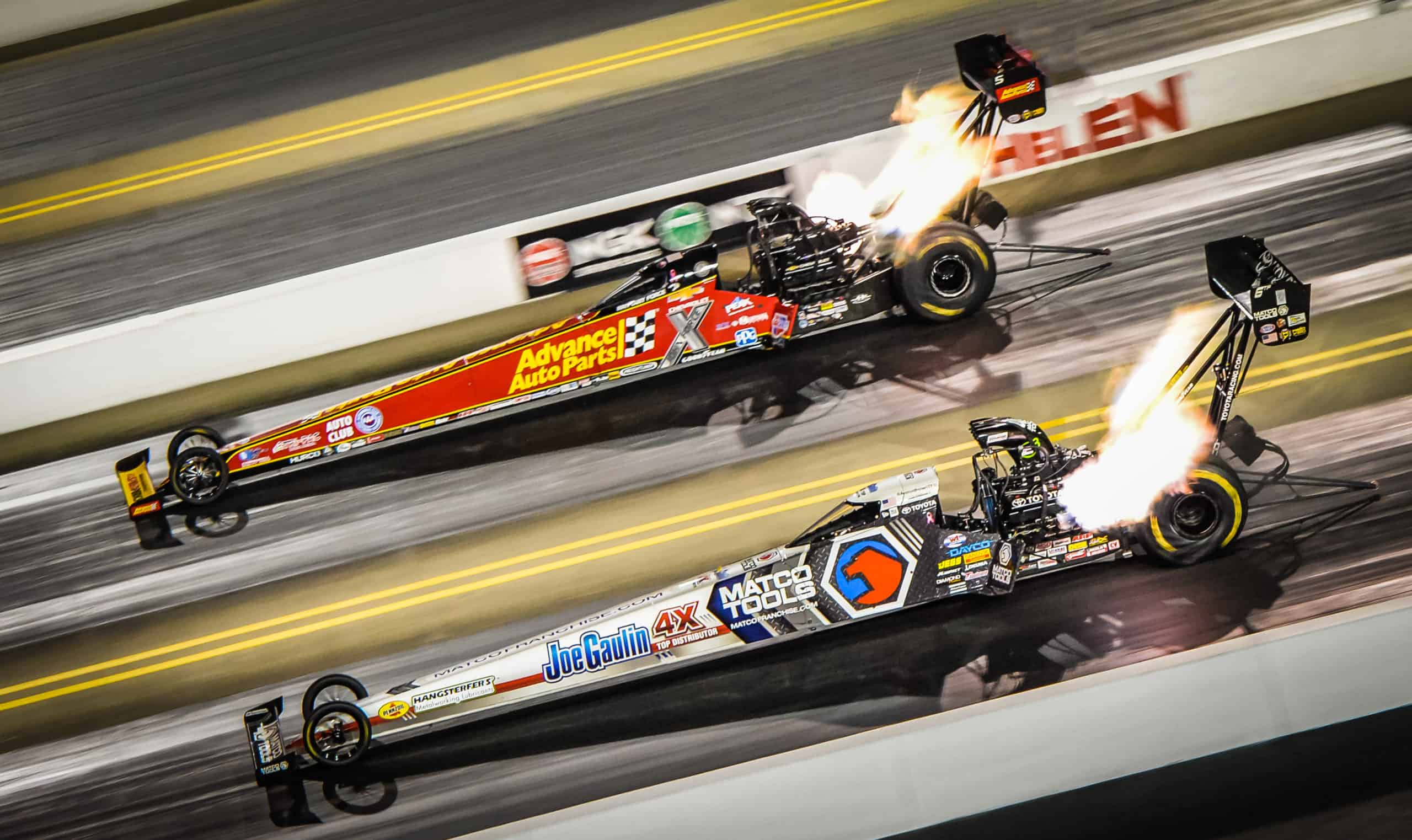 Dragsters race side-by-side at zMAX Dragway in Concord, North Carolina