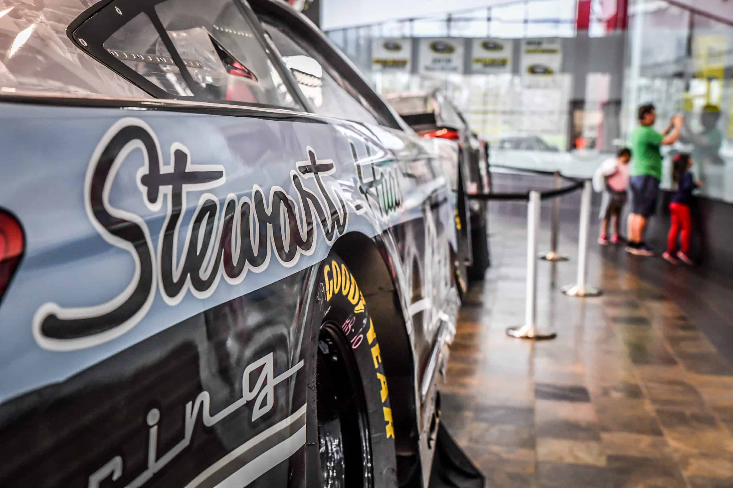 Visitors take photos inside Stewart-Haas Racing's NASCAR shop in Kannapolis 