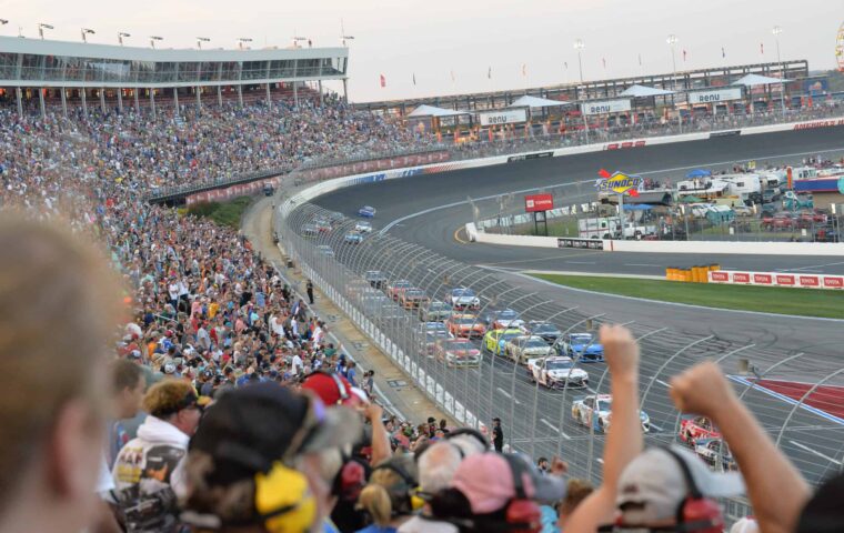 Race fans cheer on their favorite driver at the Coca Cola 600