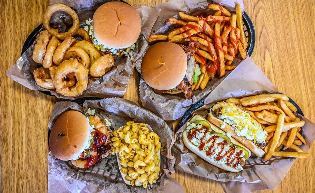 hamburgers and hot dogs on table