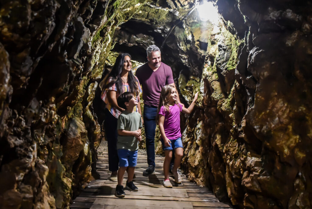 family walking in a tunnel